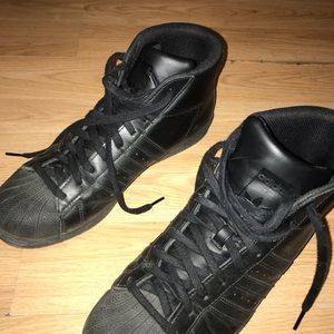 All black addidAs worn